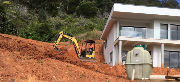 Installing a Fuji Clean home sewage treatment system in the Korora hills near Coffs Harbour is an exercise in precision.