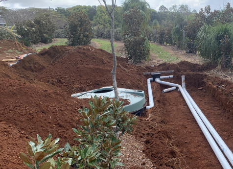 The light weight septic tank and ETA beds were installed within the existing landscaping without damage to the established plants.