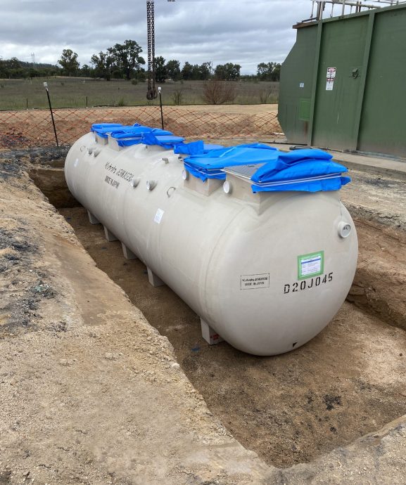 Prefabricated Kubota wastewater treatment system being installed adjacent to existing infrastructure to enable a smooth transition from old to new.