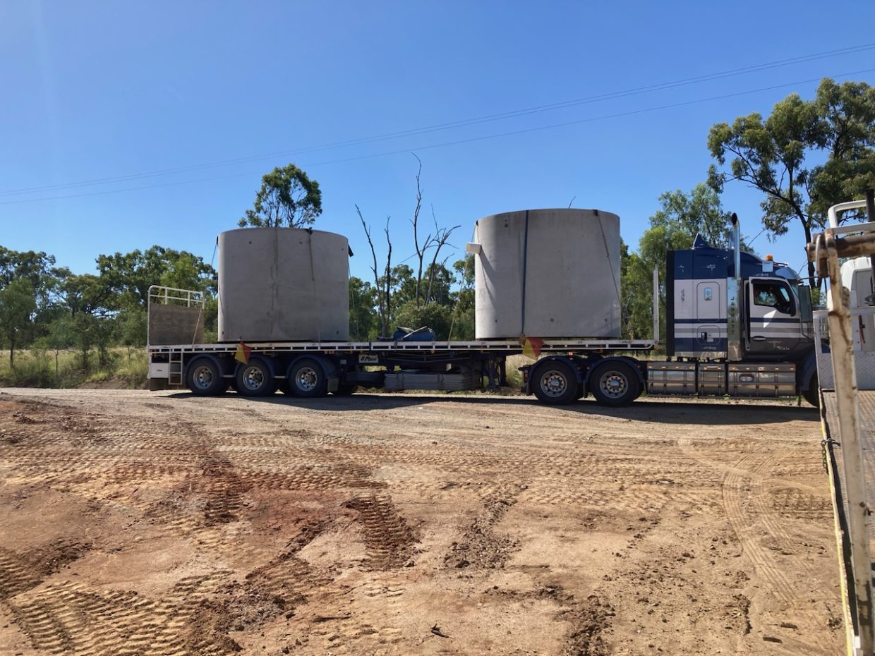 Prefabricated concrete tanks being delivered to site
