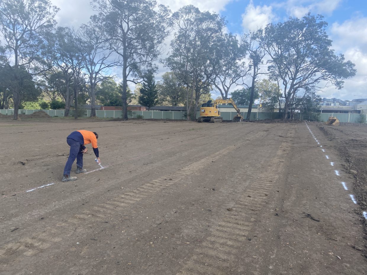 True Water staff marking out the engineered mounds for the dispersal of wastewater at the Stratford community