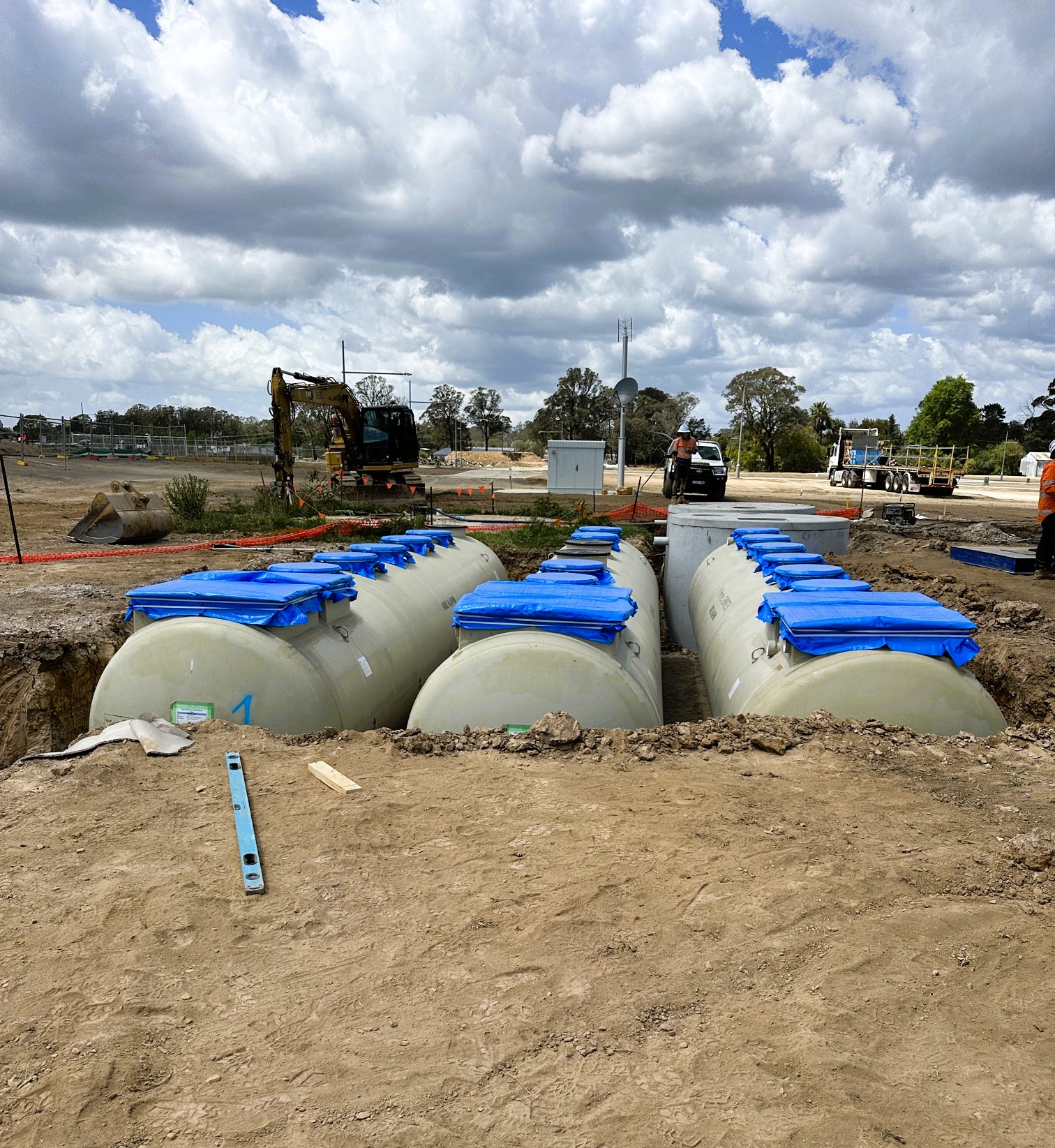 Kubota wastewater treatment tanks during installation underground.