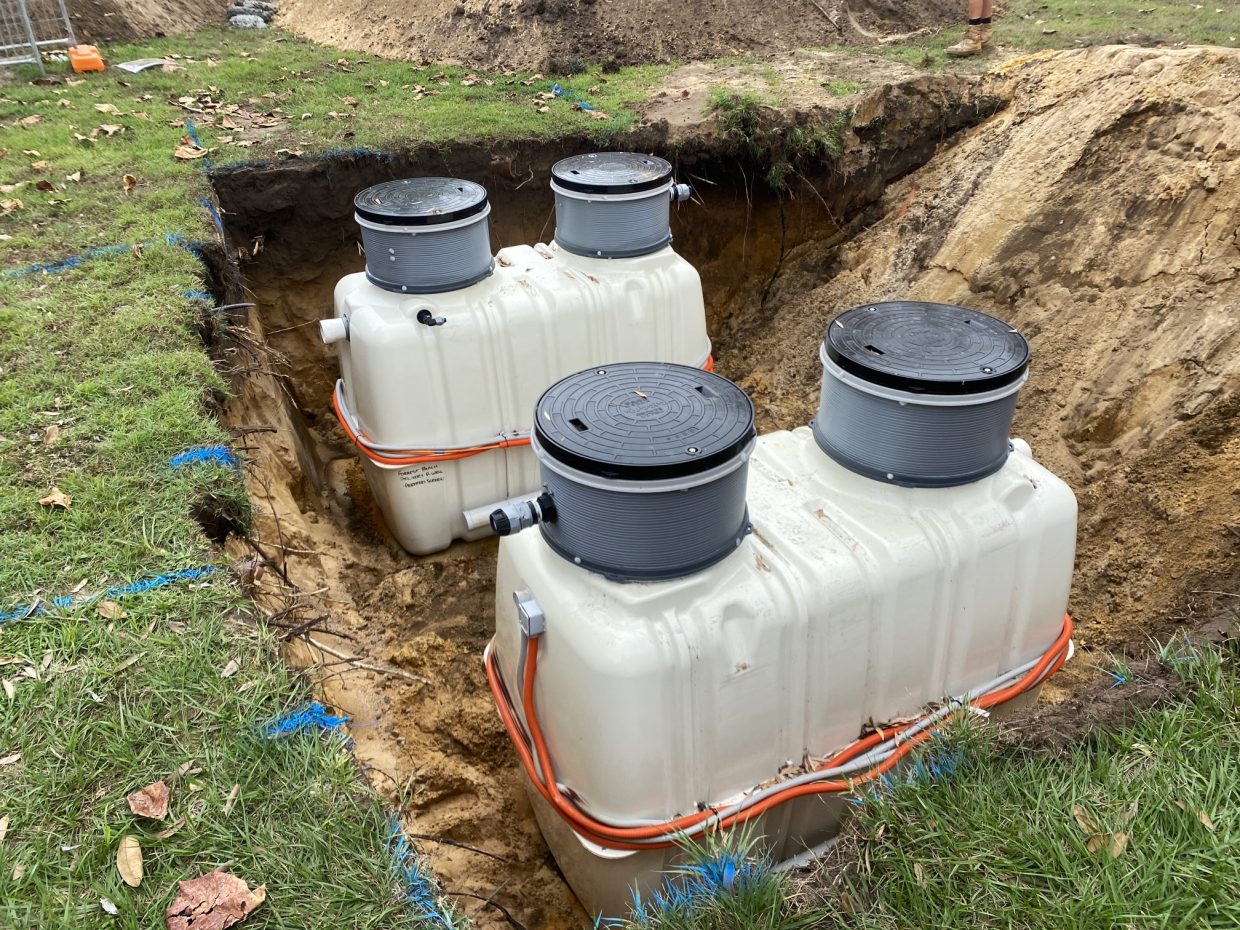 Pumpwells being installed below ground to help regulate the dispersal of treated wastewater.