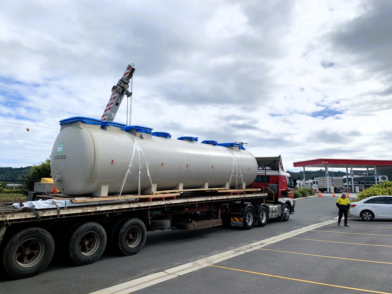 Large white tank mounted on a truck, showcasing its robust design and industrial purpose.