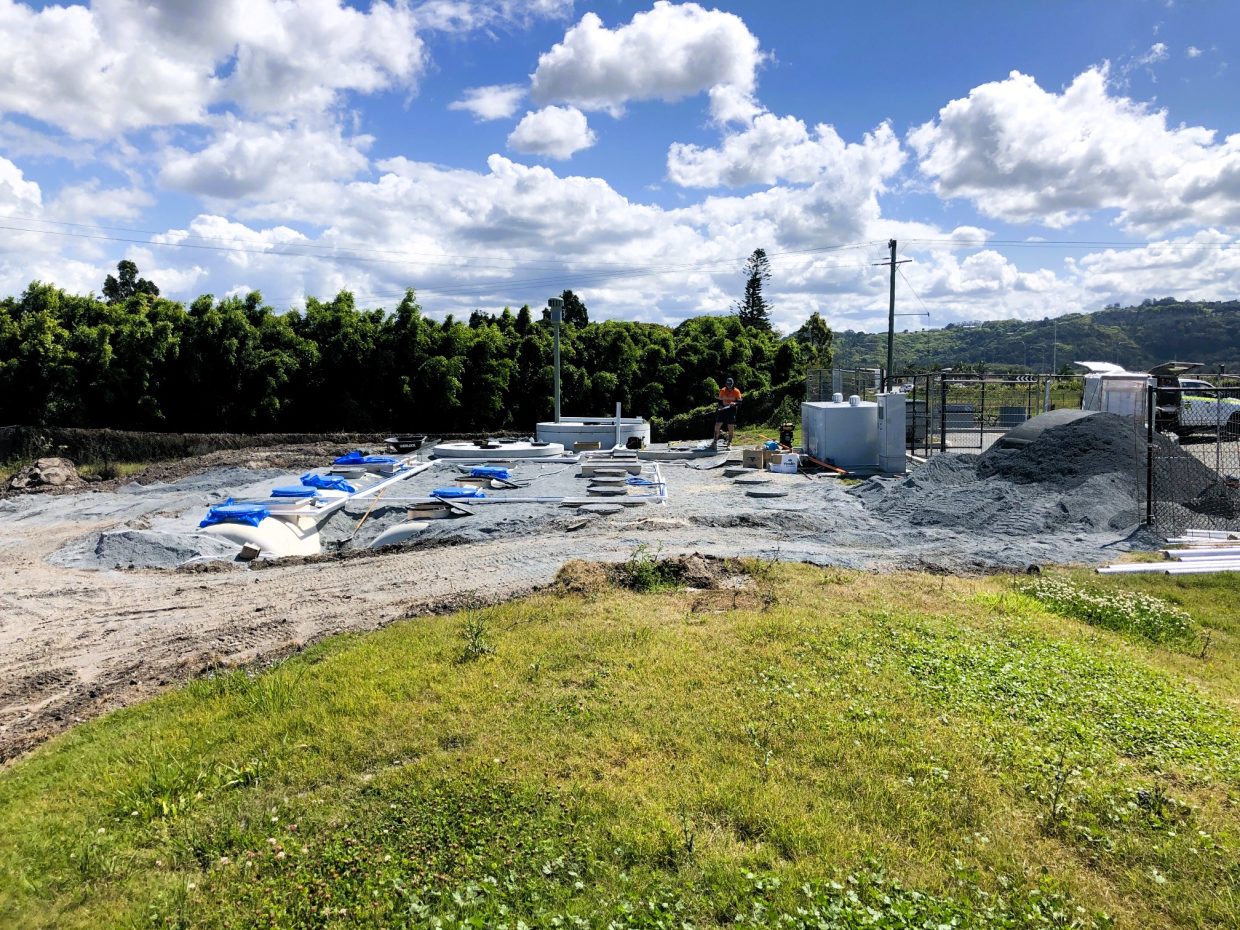 Equipment and workers engaged in construction.