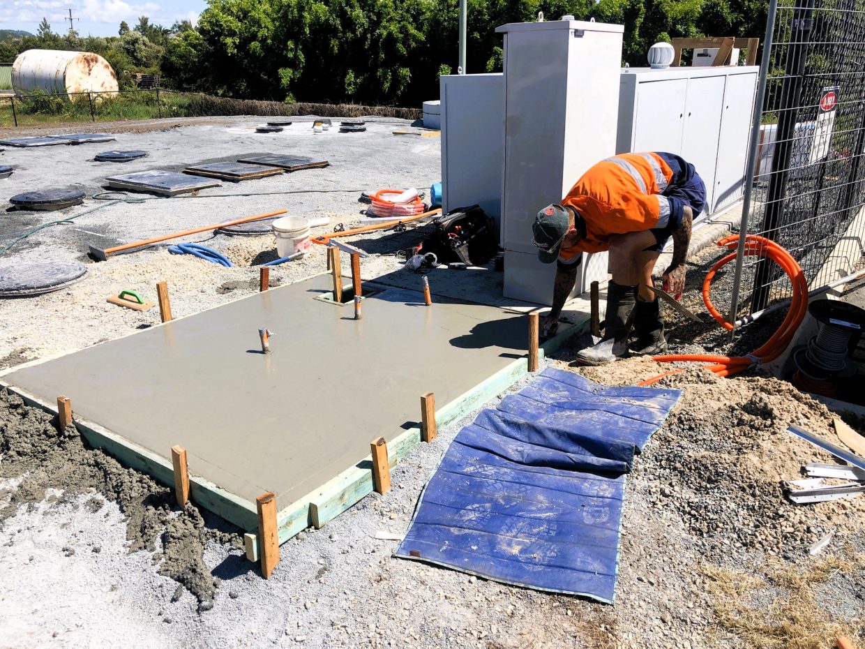 Man constructing a concrete slab.