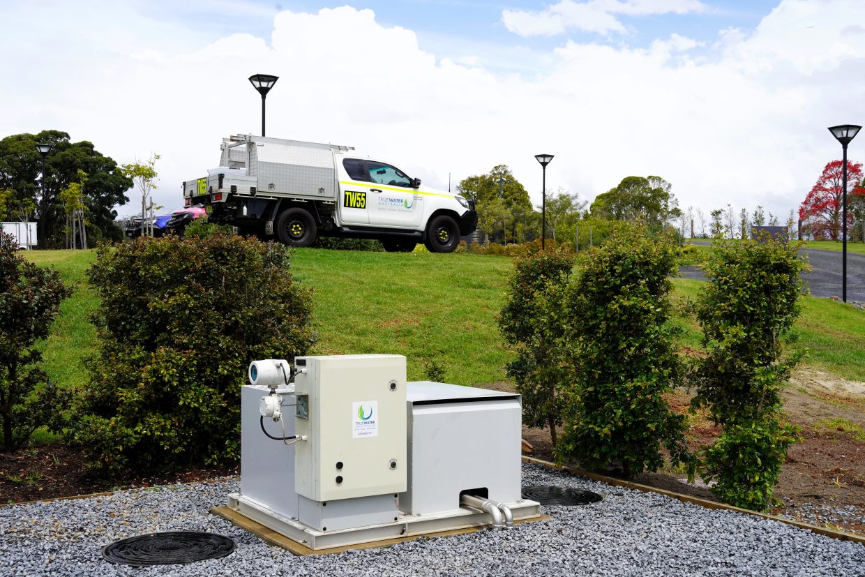 A truck parked beside a remote asset telemetry system.