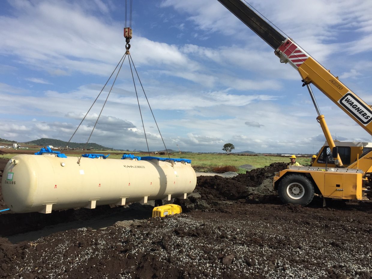 Wagners crane lifting a Kubota sewage plant during installation of the True Water wastewater treatment system