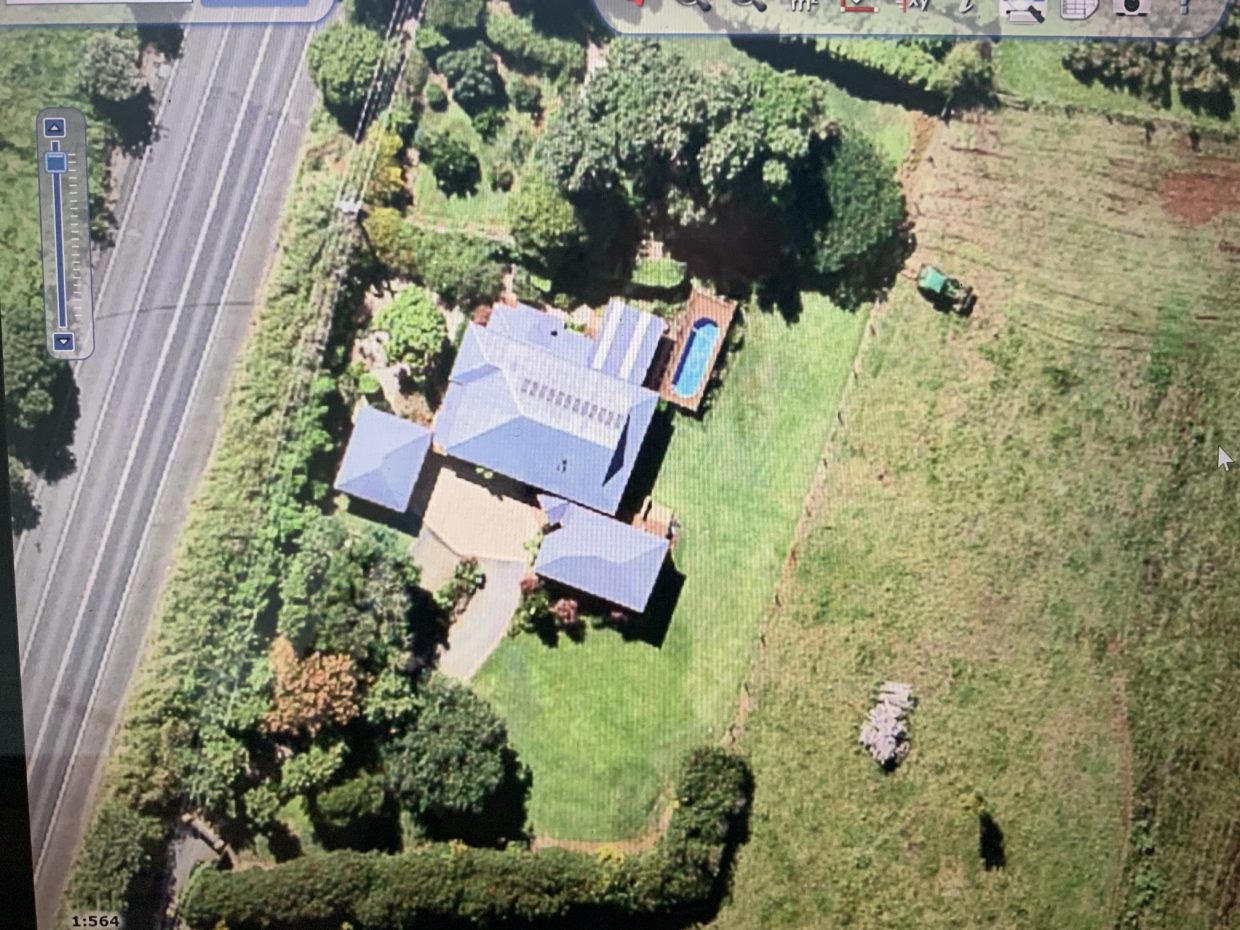 Aerial view of home on restricted block with little room availabled for a sewage treatment system