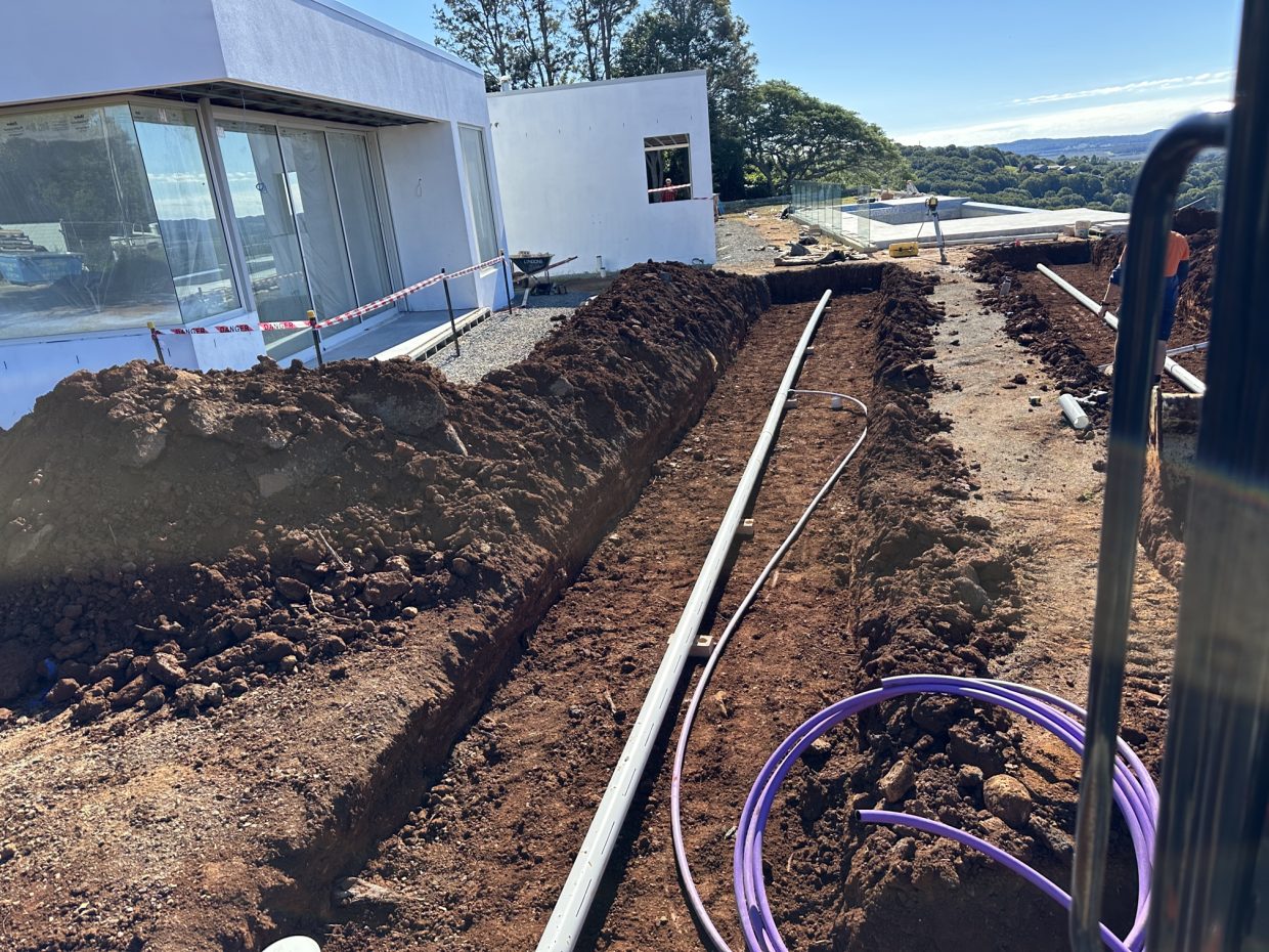 Careful excavation next to a house build to install ETA beds for a wastewater treatment system