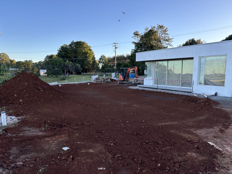 Completed ETA bed installation adjacent to luxury home construction on a block with limited space